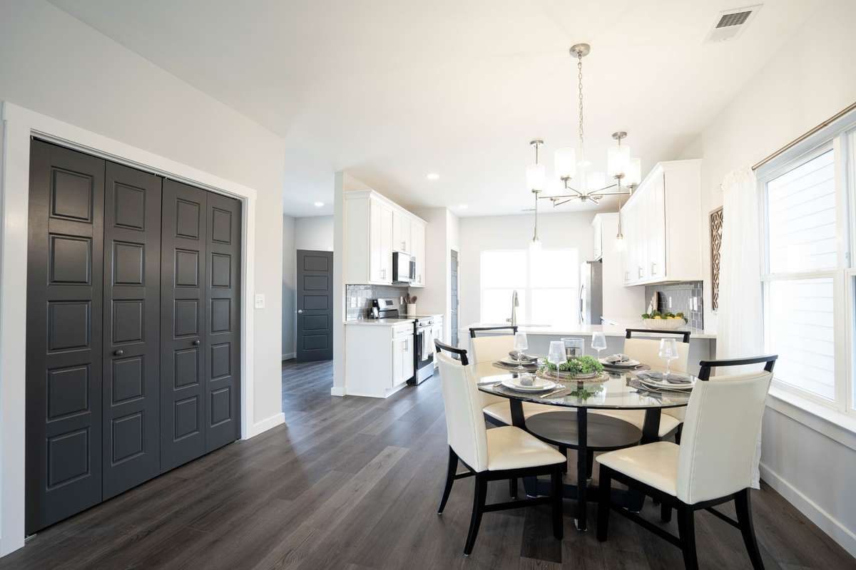 Dining area between L/R and kitchen. Custom bi-fold doors to Laundry area.