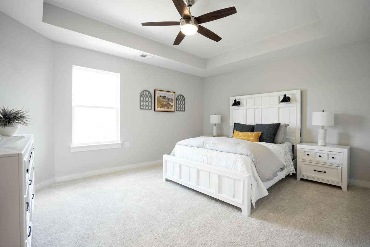 Huge Primary Suite upstairs with tray ceiling and remote fan