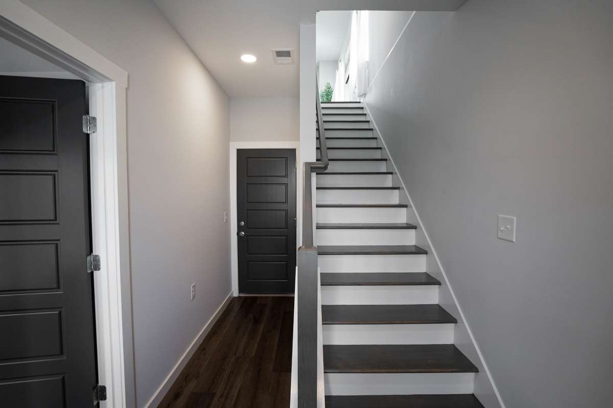 Hardwood treads on stairs to middle level.