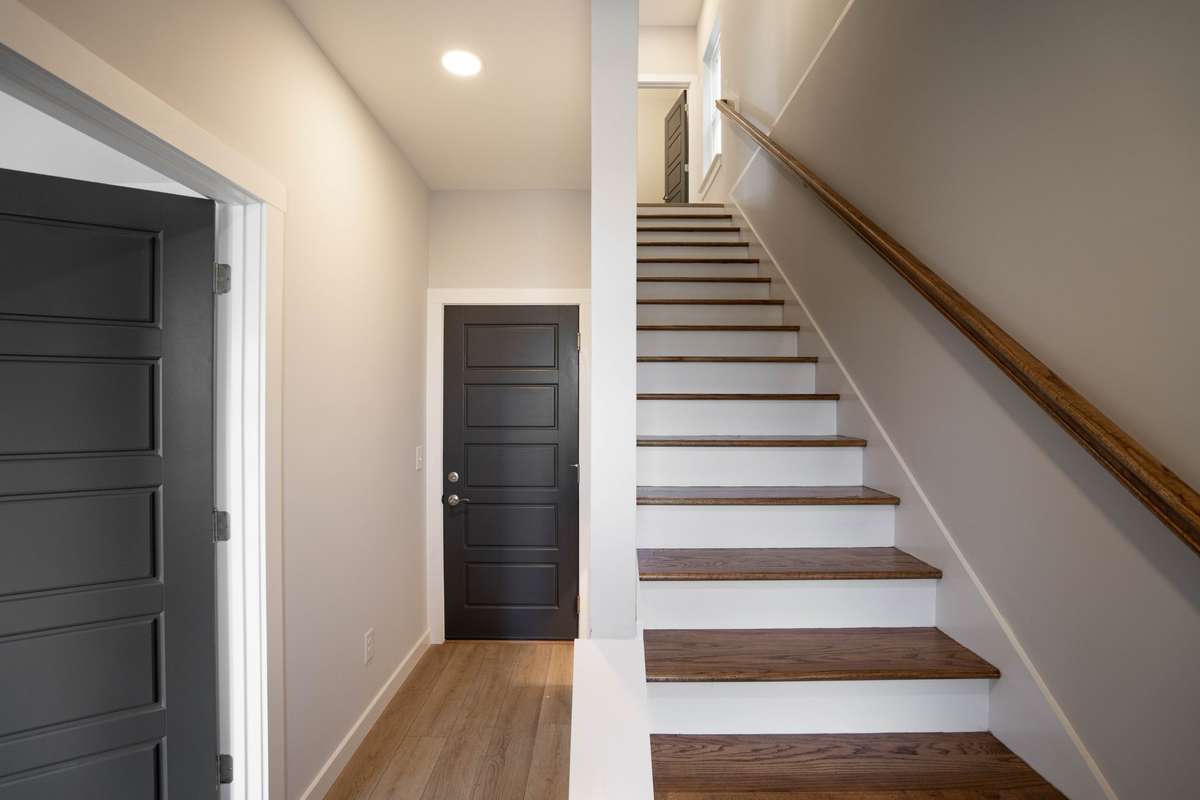 Beautiful LVP flooring downstairs and on 2nd floor; and hardwood treads on stairs from 1st to 2nd floor.
