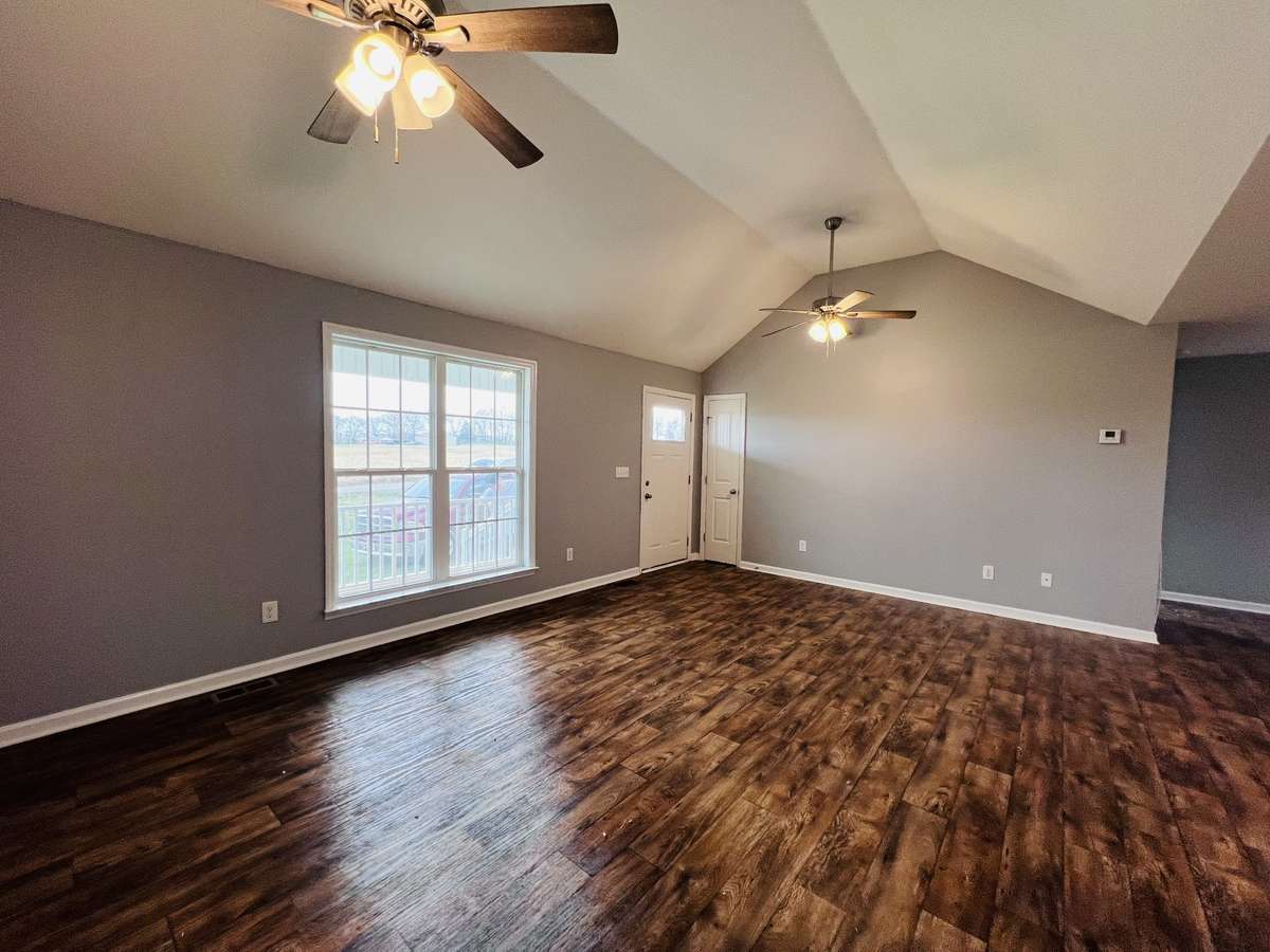 Another view of living area, extra closet near front door