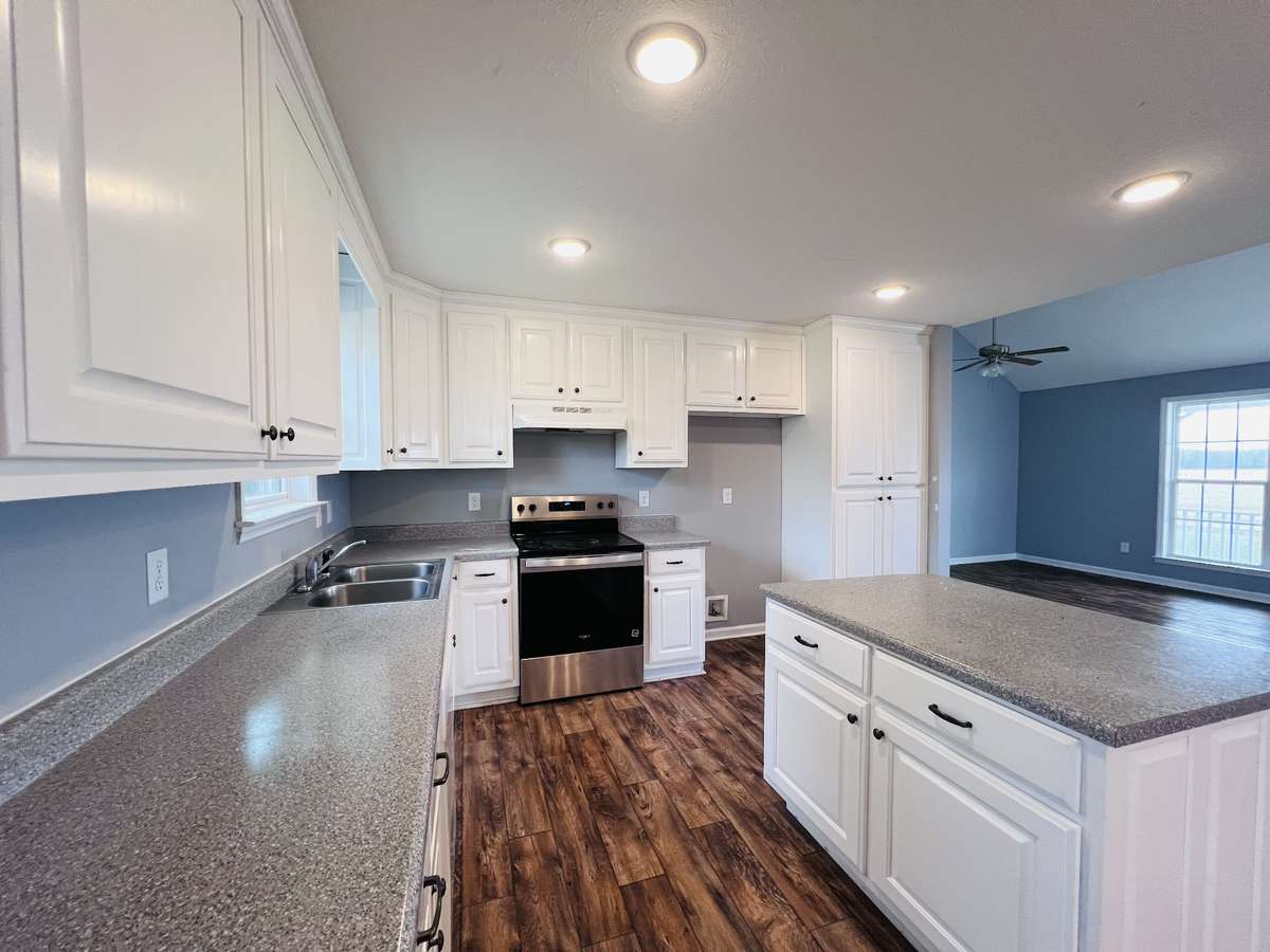 Kitchen with island and recessed lighting
