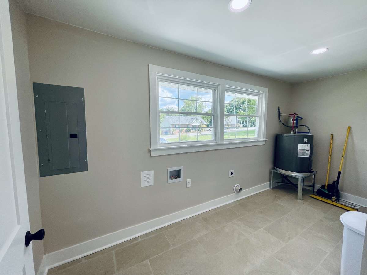 Nice size Laundry Room with New Tile Floors.