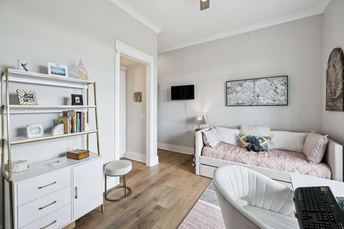 Bright secondary bedroom with large windows overlooking scenic countryside views. Generous layout offers flexibility for guests, family, or a private office while enjoying abundant natural light.