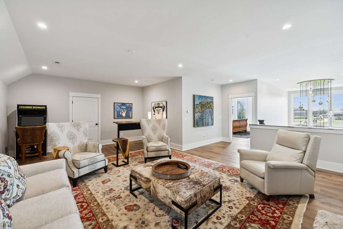 Spacious upstairs bonus room with plenty of room for a media area, game space, or secondary living room. Open layout with recessed lighting and easy access to nearby bedrooms and baths, a versatile space that adapts to your needs.