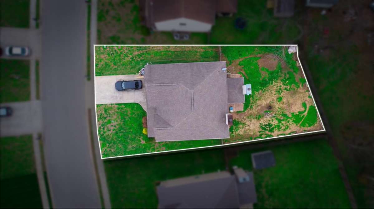 Aerial drone view showcasing the full 0.20-acre lot with outlined property boundaries, spacious yard, and prime cul-de-sac location in the Sunset Meadows community.