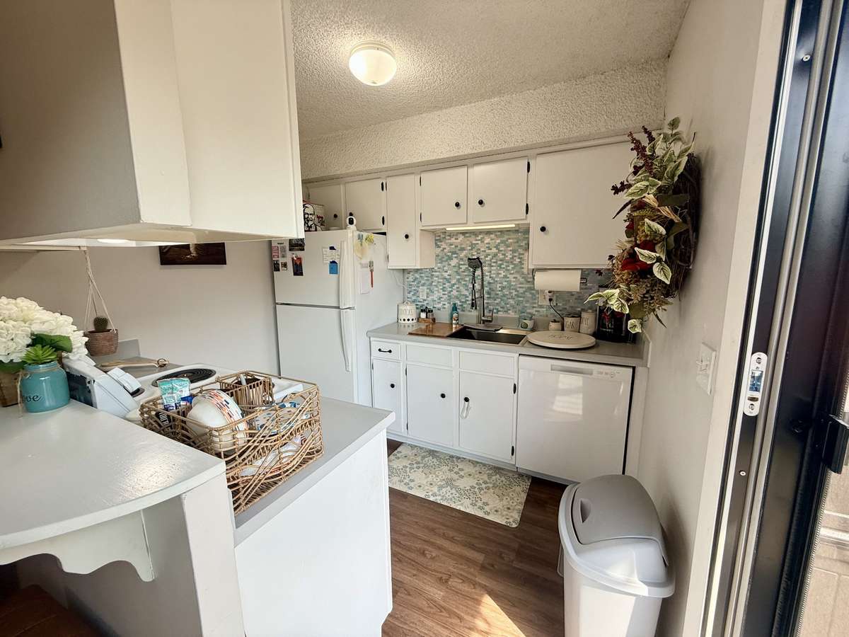 Kitchen with lots of bright natural light and tile backsplash