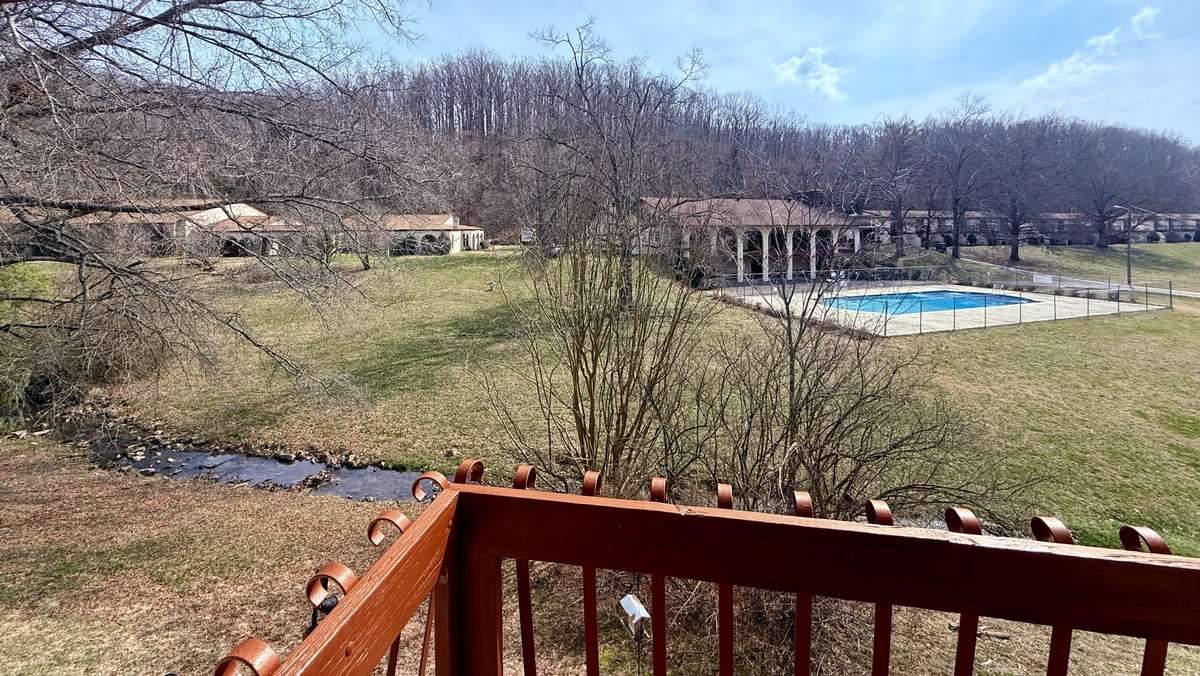 View from the back 2nd story balcony overlooking the creek and community pool