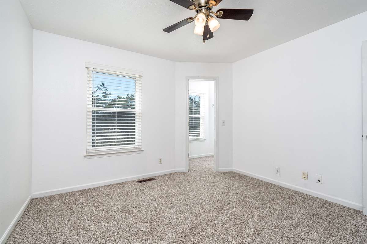 Primary Bedroom is spacious with sunny window