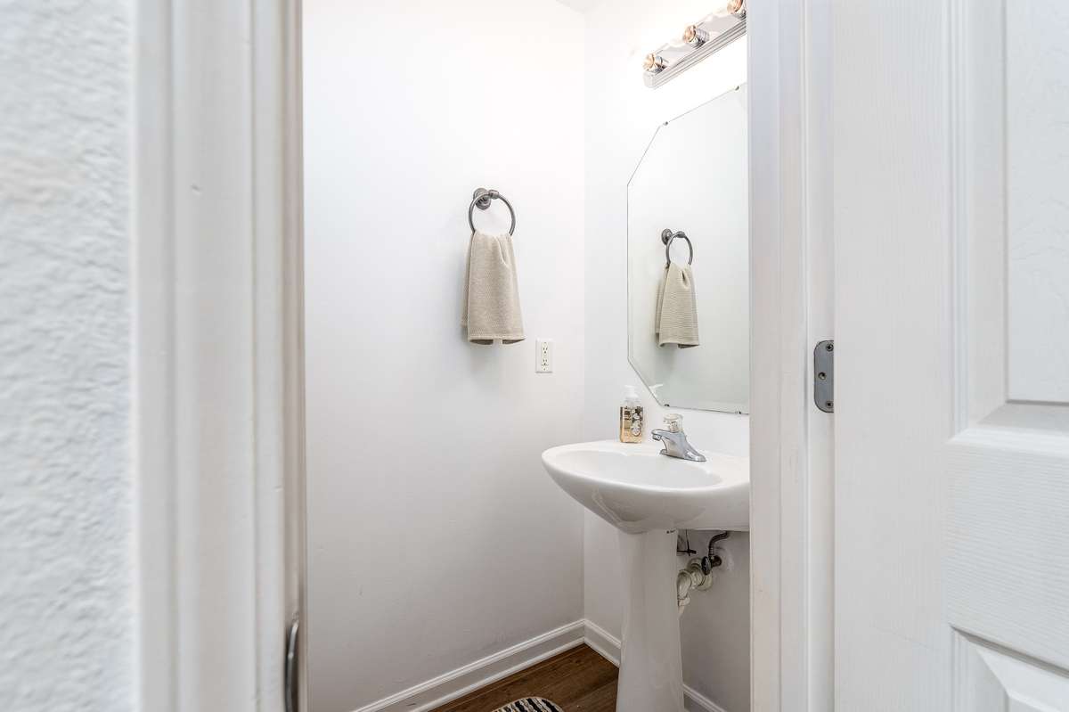 Convenient Half Bath downstairs with pedestal sink