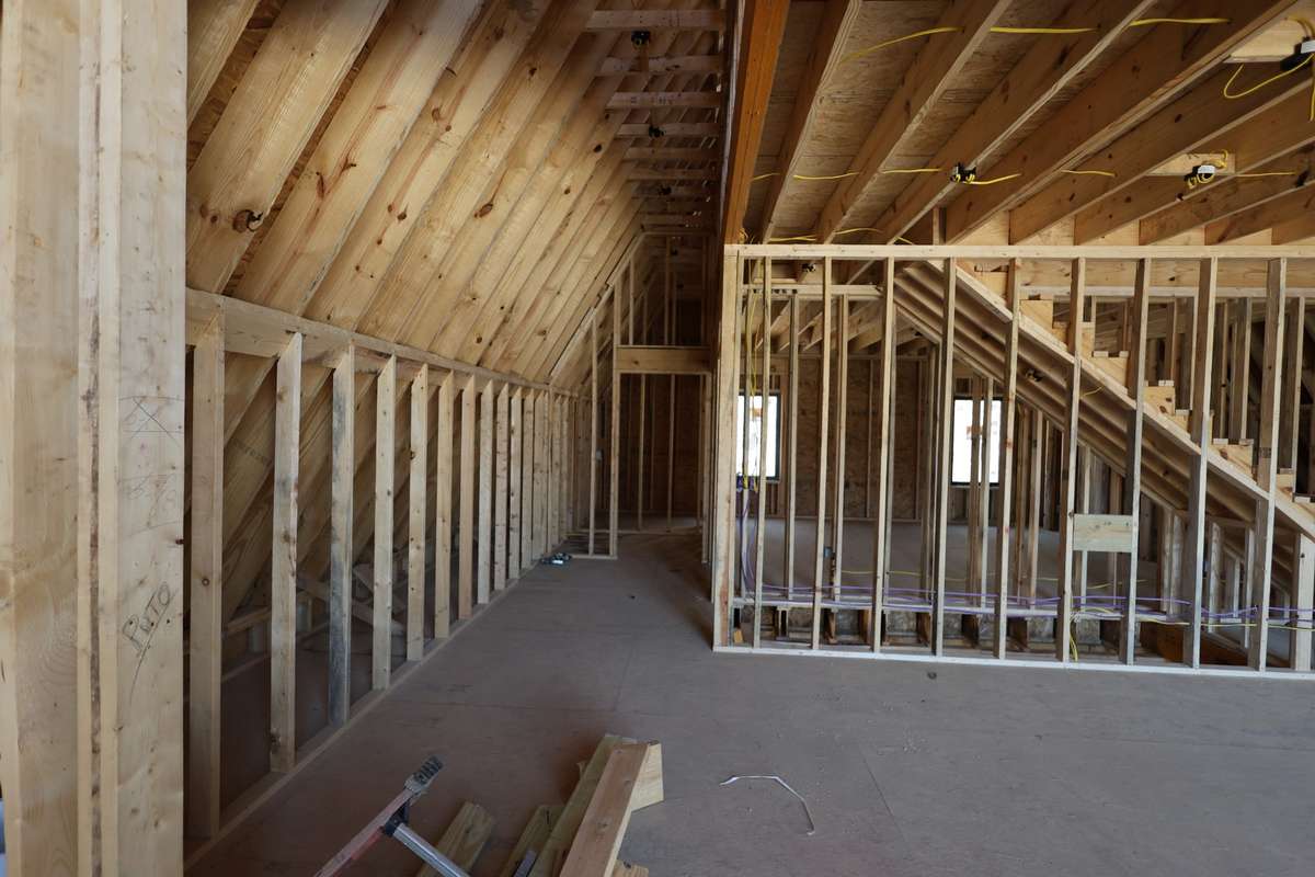 Custom cabinets will run along the left wall. Hallway ending in laundry room and Master Bedroom.