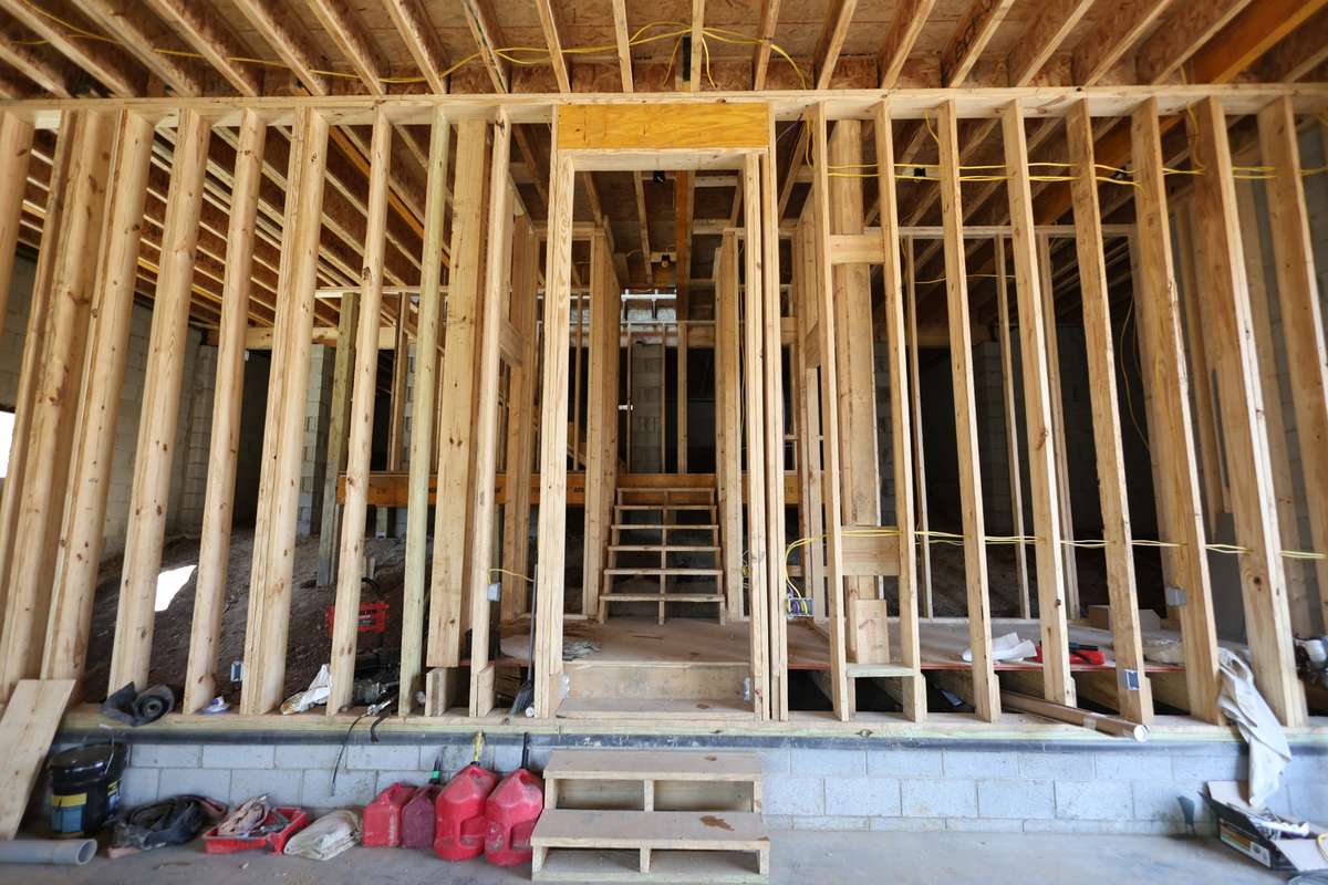 View from garage of stairs leading to main level. Utility/storage closet off the right of the landing .