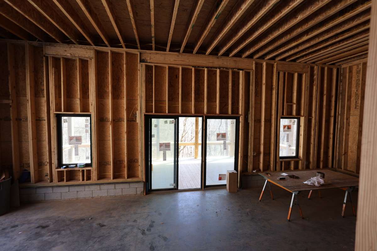 Garage from landing. Sliding glass doors lead to large covered deck.