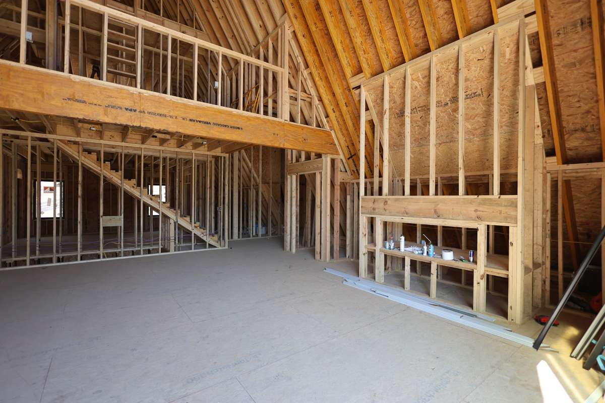 Living room view from sliding glass doors. Large closet located to the left of the fire place.