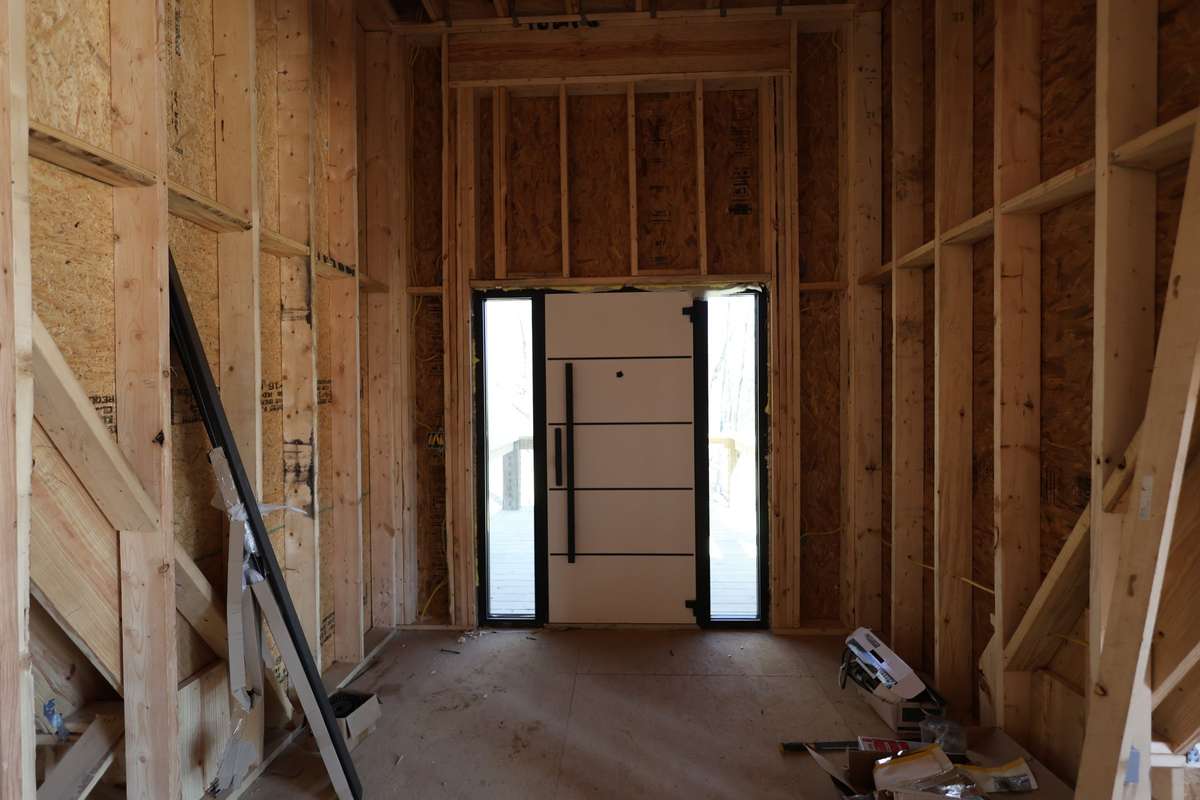 Foyer with high- end steel security door with key pad and finger print access.