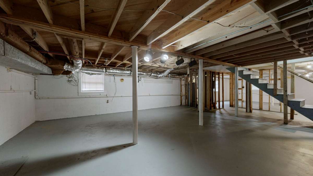 full unfinished basement with l-o-a-d-s of storage space