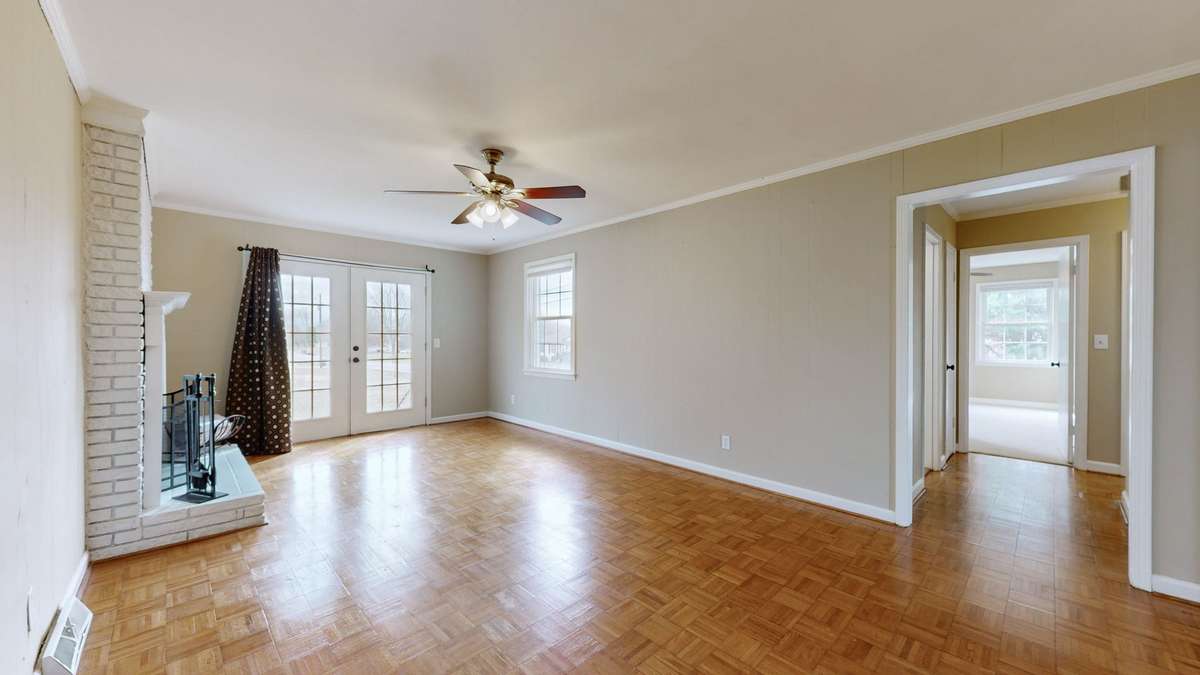 French doors lead from den to back yard
