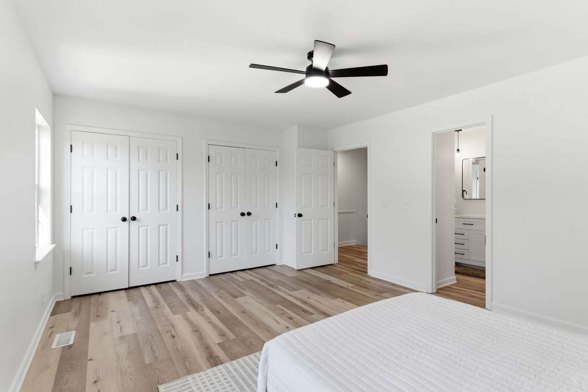 En-suite bathroom in the primary bedroom with double closet space.