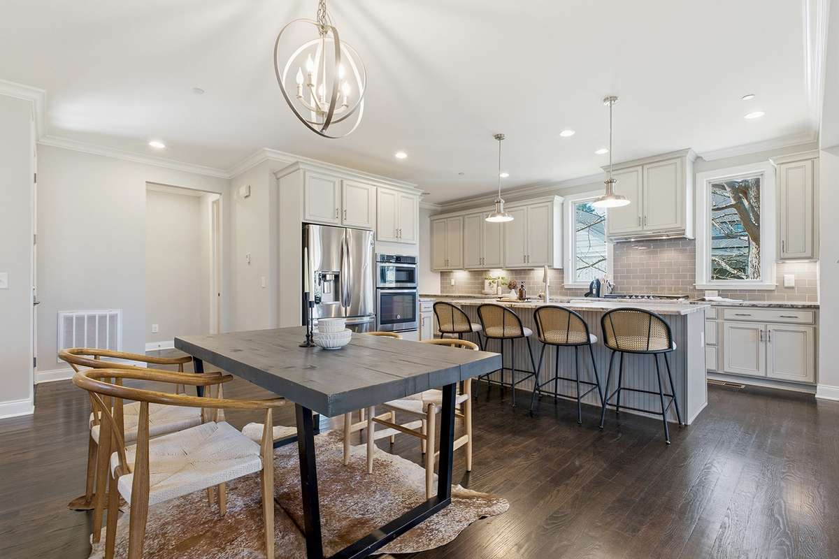 Open dining room smoothly flows into eat-in kitchen