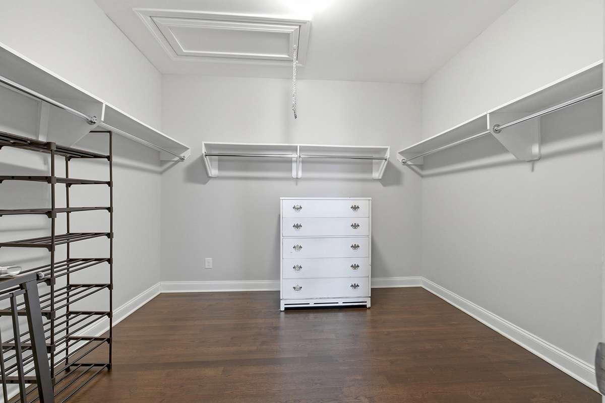 Large walk-in closet + extra linen closet, attic storage access