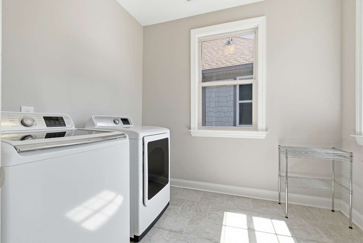 Sunny laundry room w/storage space + XL hall closet