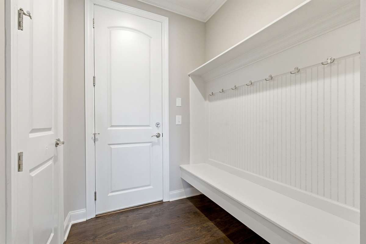 Mud room area w/built-in storage + bench seating