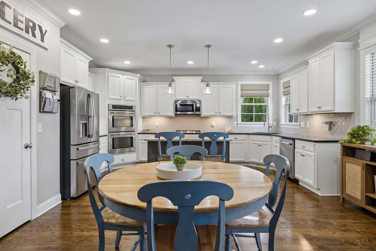 Granite countertops and a gas cooktop blend beauty and function for effortless cooking.