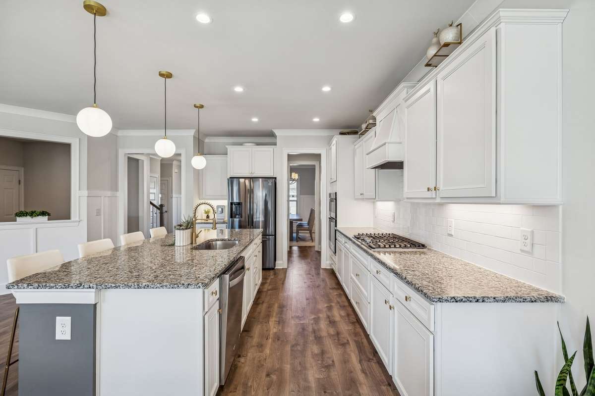 Large center island with generous bar seating, ideal for everyday meals and entertaining! 606 Rumsford Lane, Mt Juliet, TN 37122