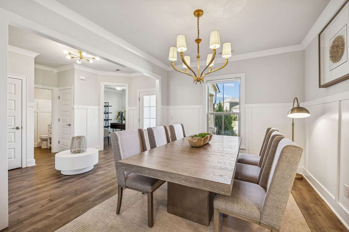 Spacious formal dining room with detailed trim work and a statement chandelier for memorable dinners and celebrations! 606 Rumsford Lane, Mt Juliet, TN 37122