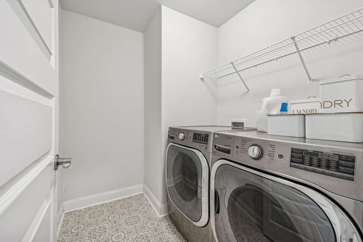 Spacious laundry room with tiled floor and shelving! 606 Rumsford Lane, Mt Juliet, TN 37122
