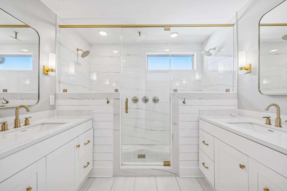 Luxurious primary bath is fully tiled with glass enclosed shower and his and her vanities! 606 Rumsford Lane, Mt Juliet, TN 37122