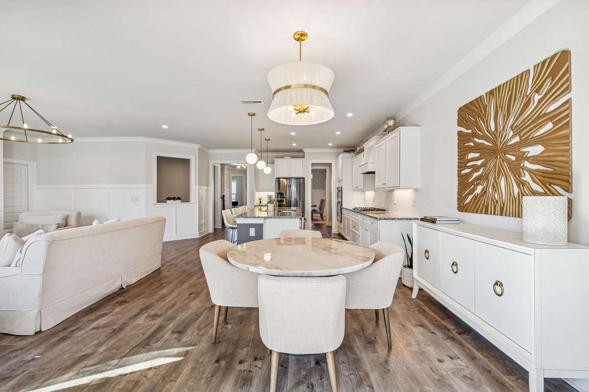Bright dining space featuring a stylish chandelier and open flow to the kitchen! 606 Rumsford Lane, Mt Juliet, TN 37122