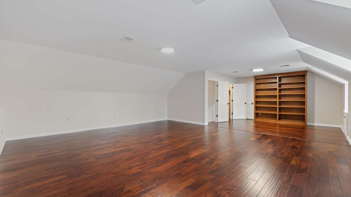 Full size access door to 196 sq.ft. floored attic storage space from the bonus room.