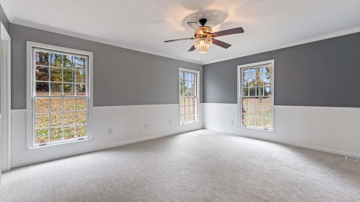 Primary Bedroom suite with lots of natural light.