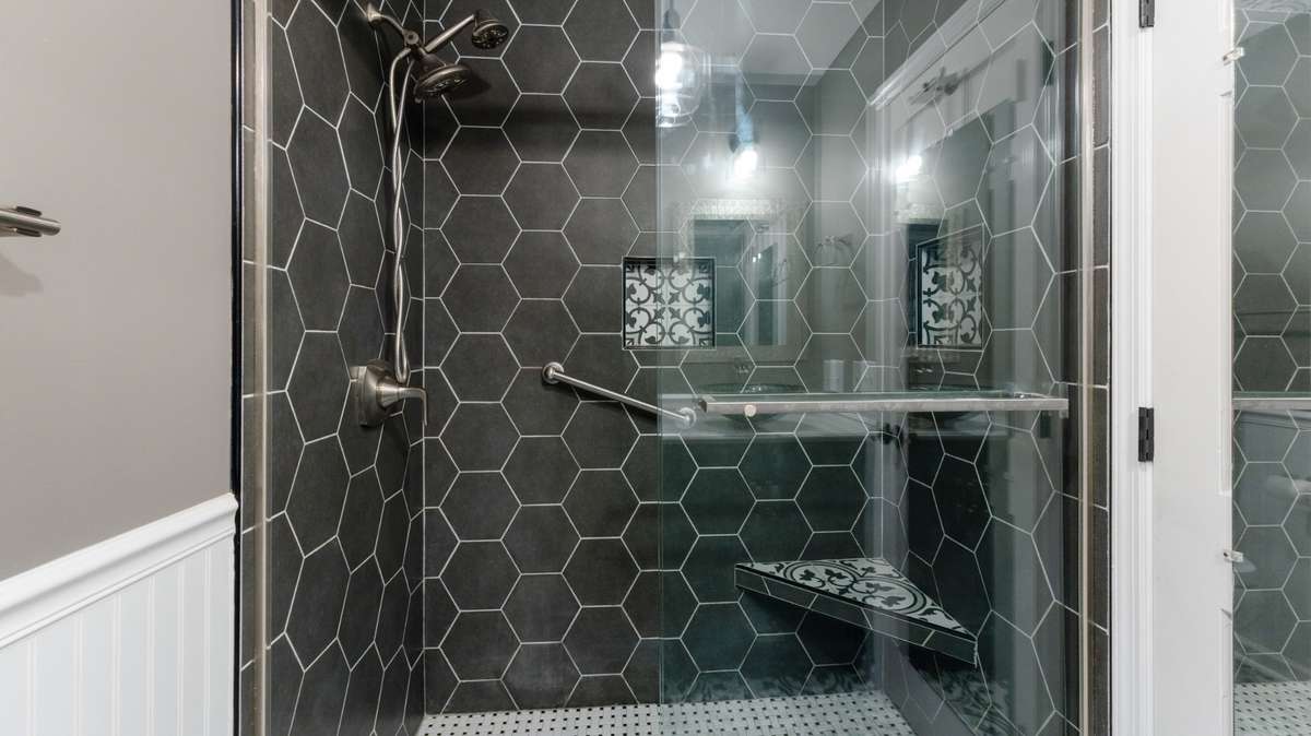 Large tile shower in hall Bath