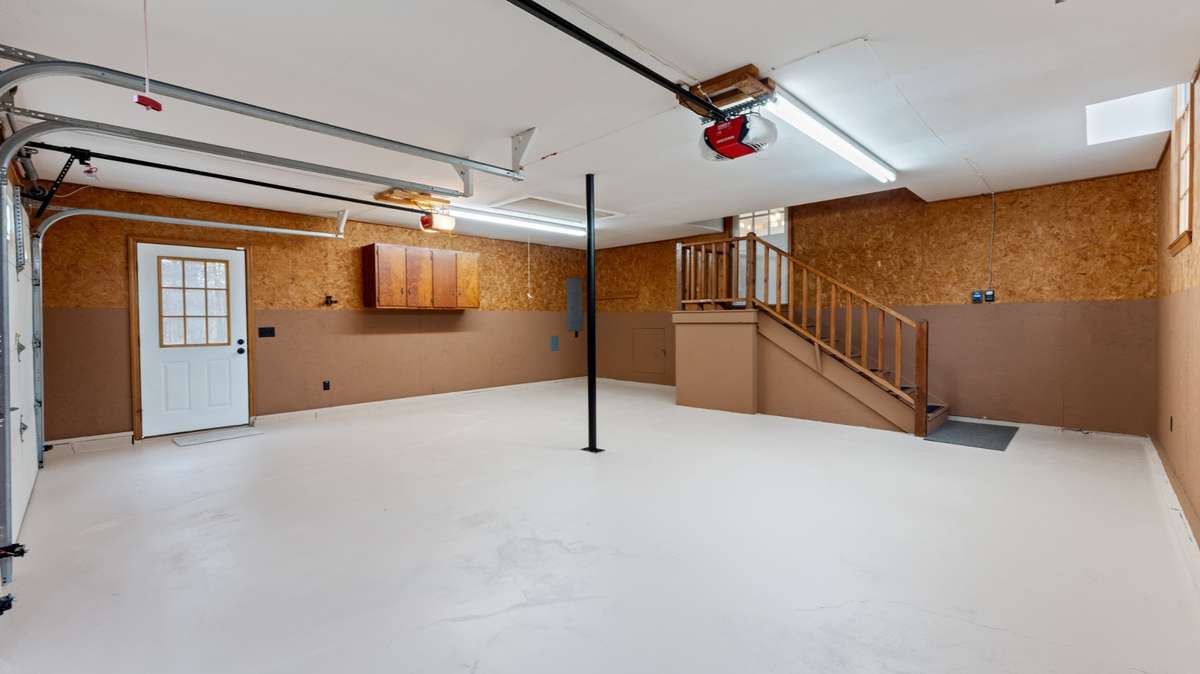 Pull down stairway gives access to an additional 619 sq. ft. of floored storage space above the garage.