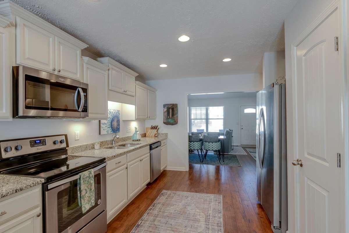 Another great angle of the kitchen, and yes, those are granite countertops.
