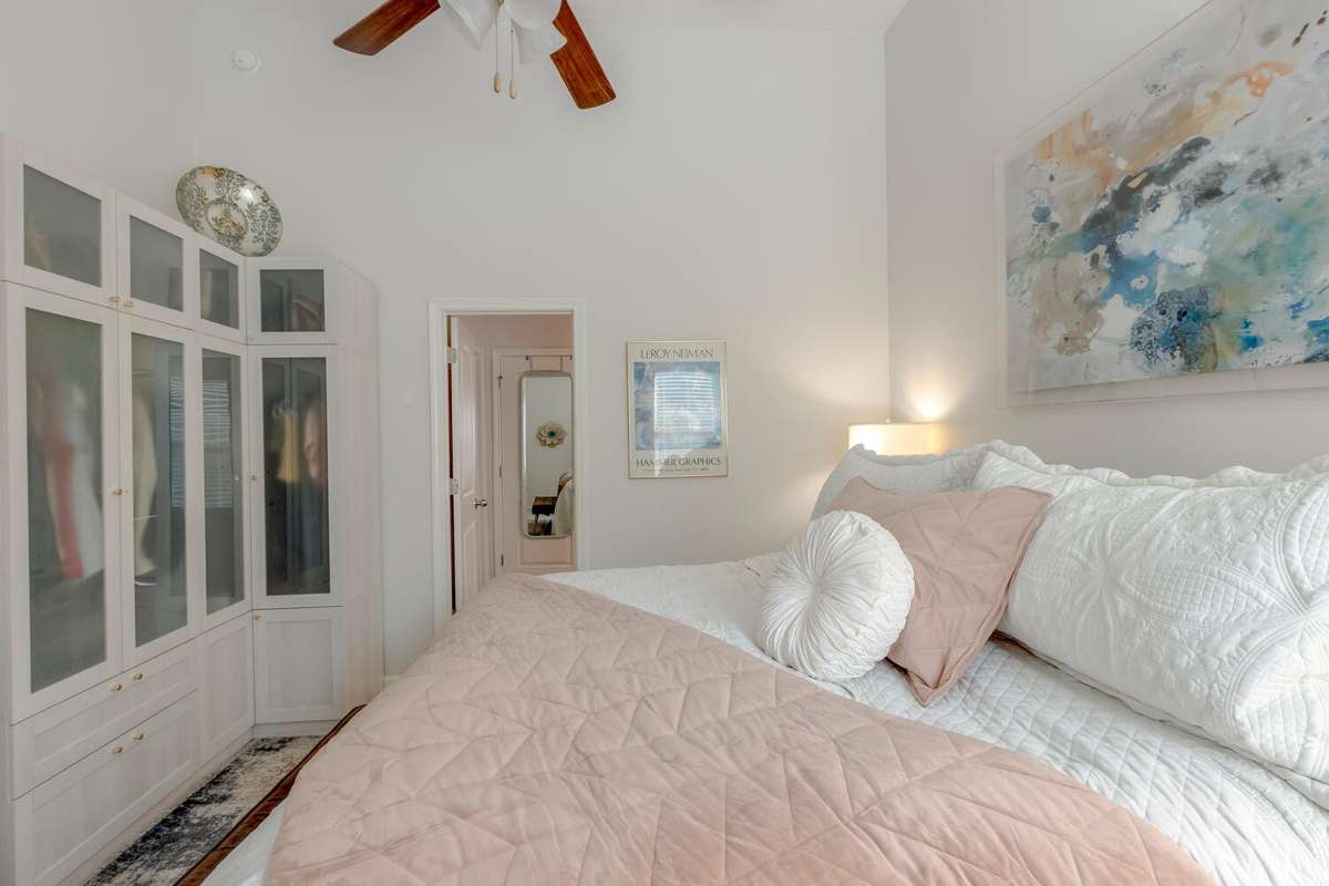 The king-sized bed fits comfortably in this room.
