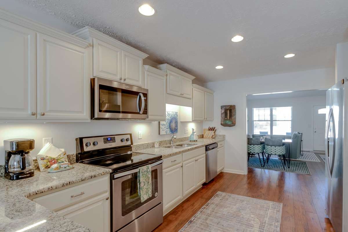 Close-up view of the kitchen cabinets and granite counters.