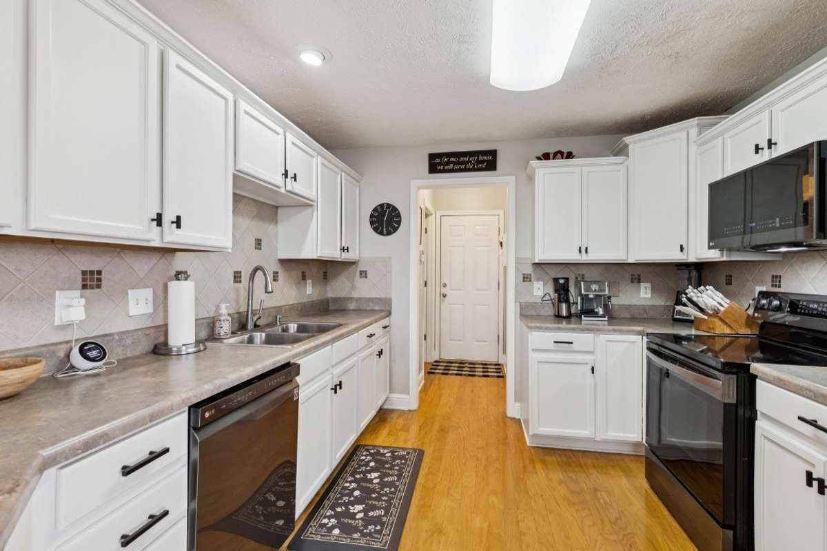 Kitchen with black stainless appliance