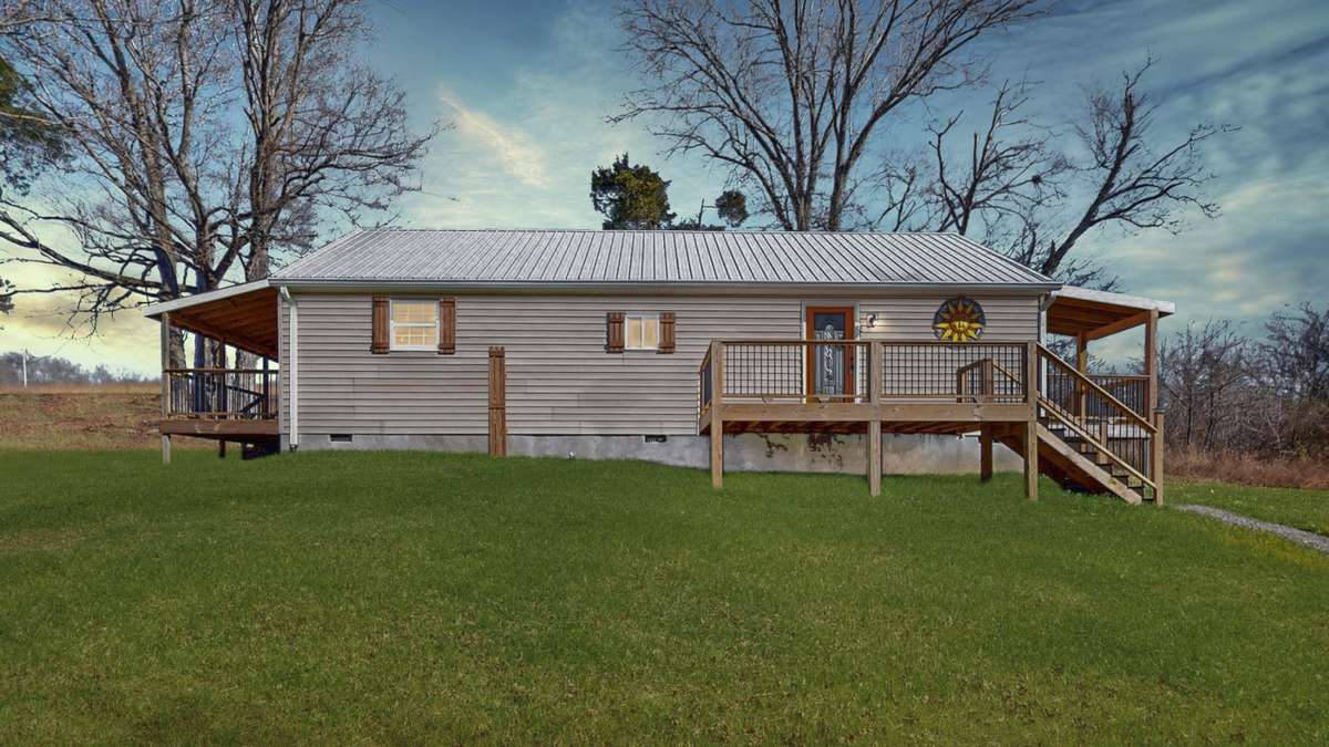 3 Porches perfect to relax on! 
(Virtually edited sunset and grass)