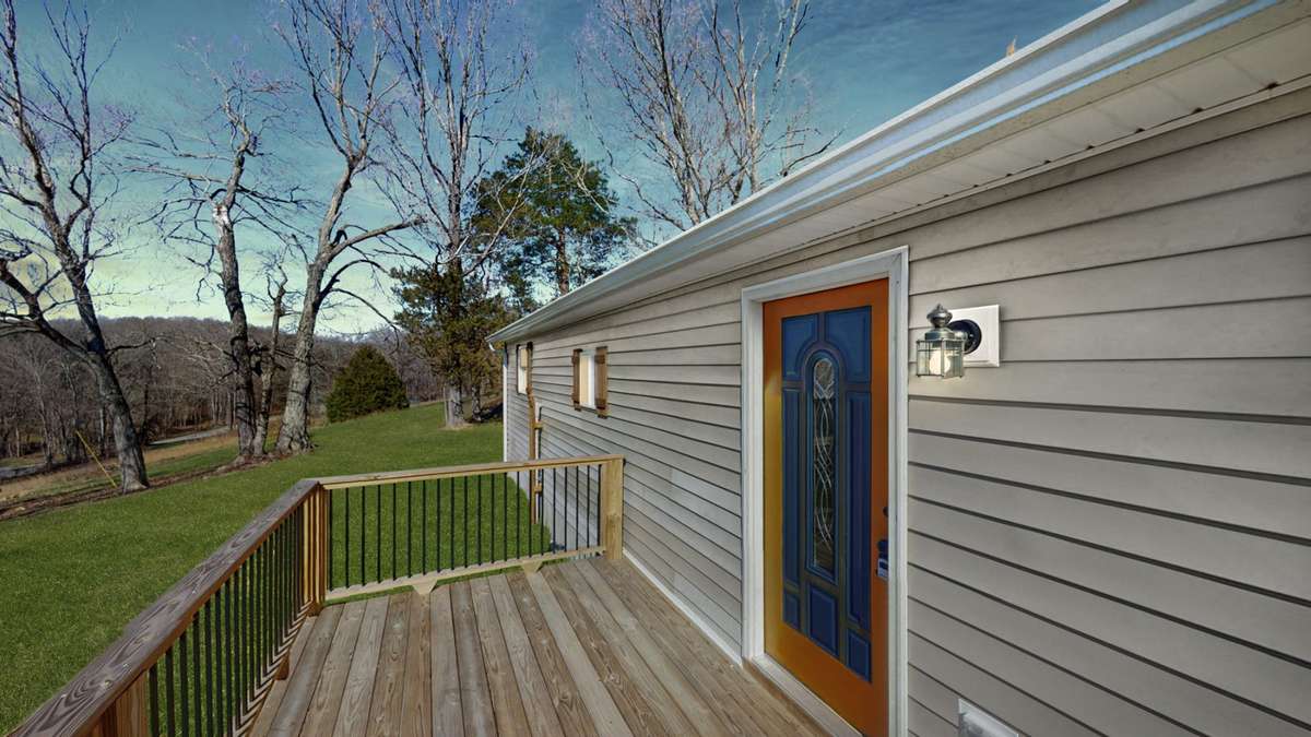 3 Porches perfect to relax on! 
(Virtually edited sunset and grass)