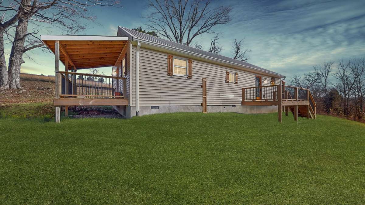 3 Porches perfect to relax on! 
(Virtually edited sunset and grass)
