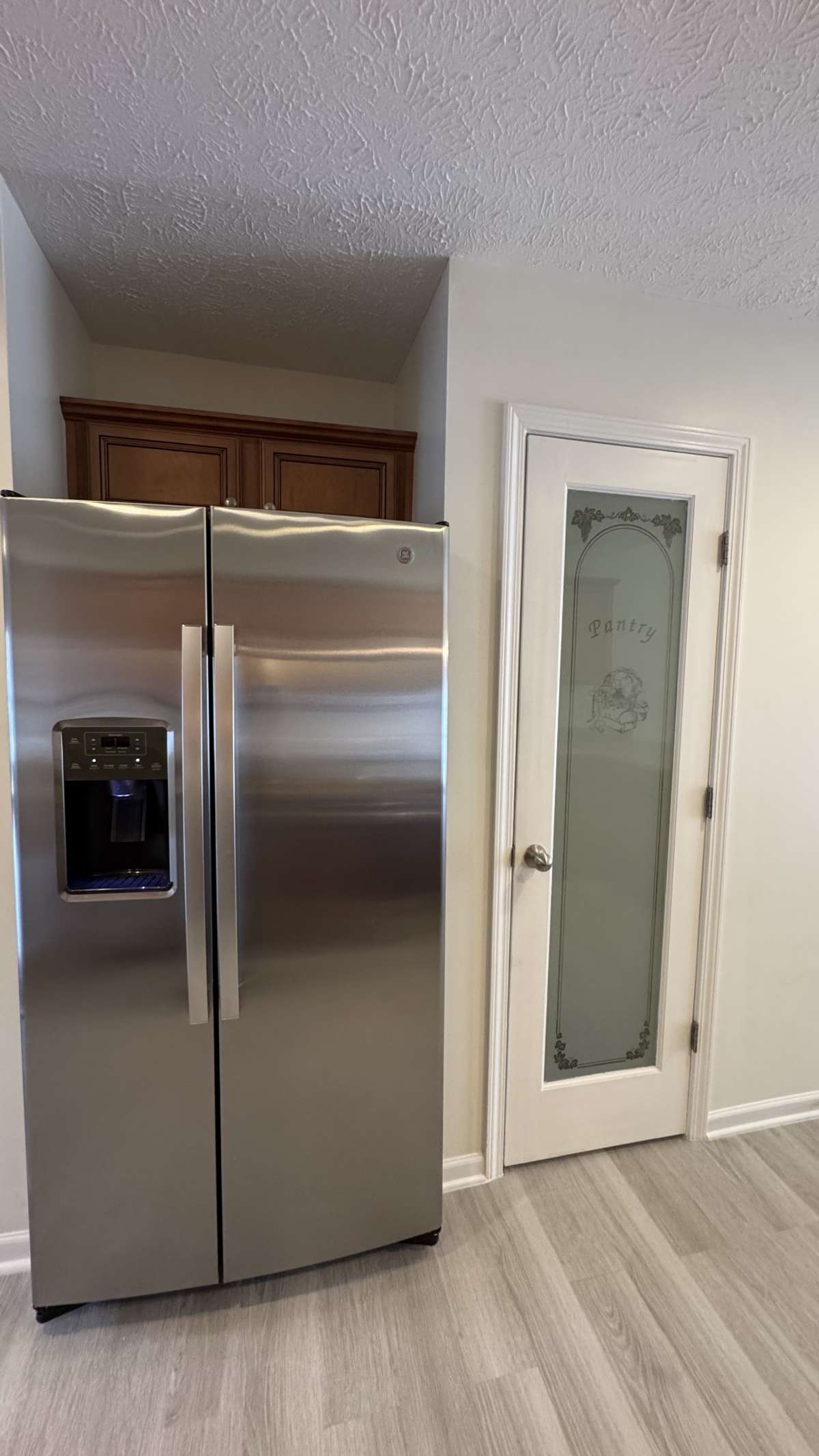 Stainless appliances Refrigerator remains. Has a separate pantry
