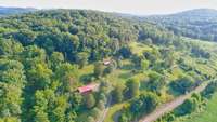 3955 Kennedy Creek Rd. 33 Acres with garage/shop and manufactured 2 BR, 1 bath home.