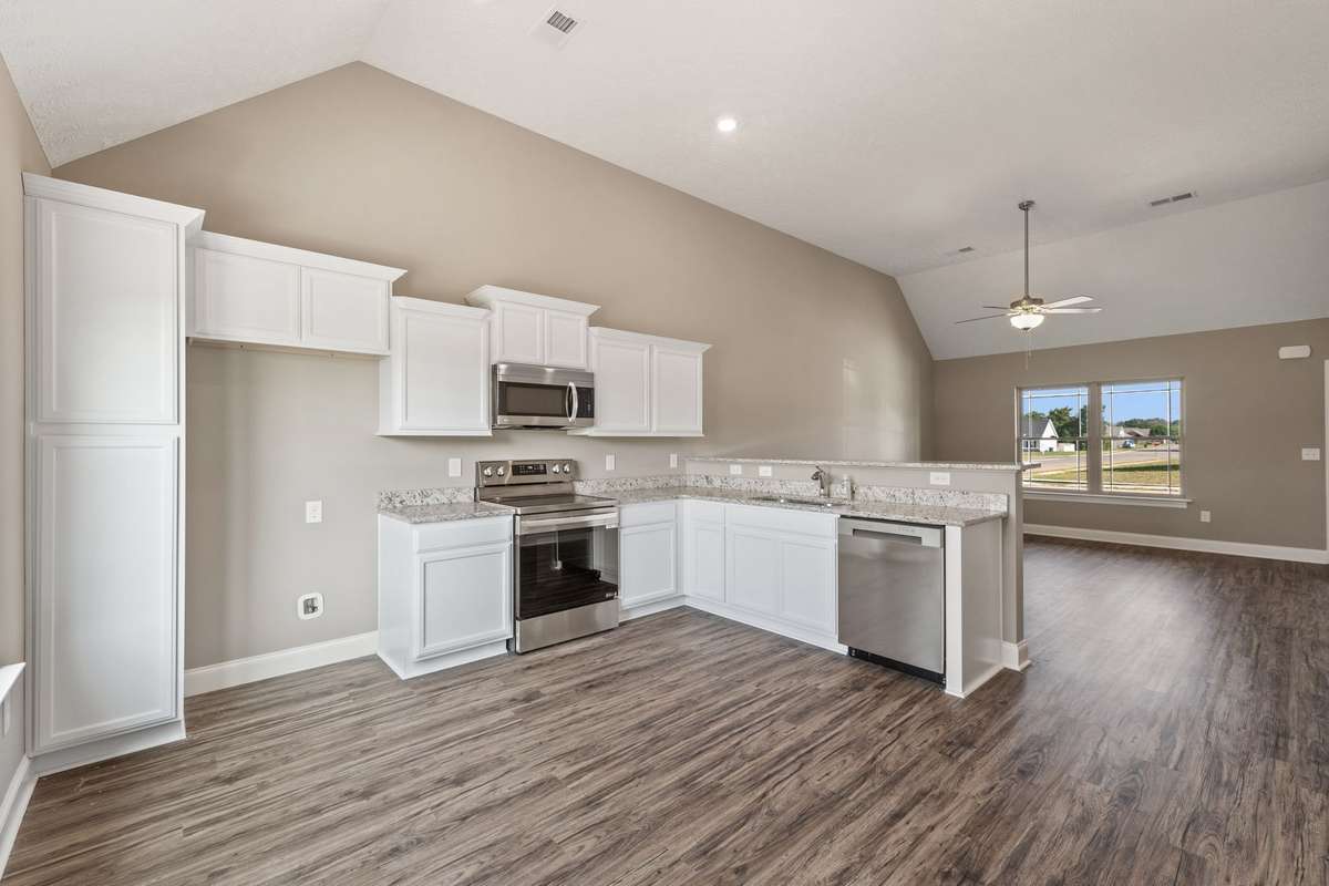 Upgraded Stainless Smooth Top Stove, Microwave and Dishwasher are provided.