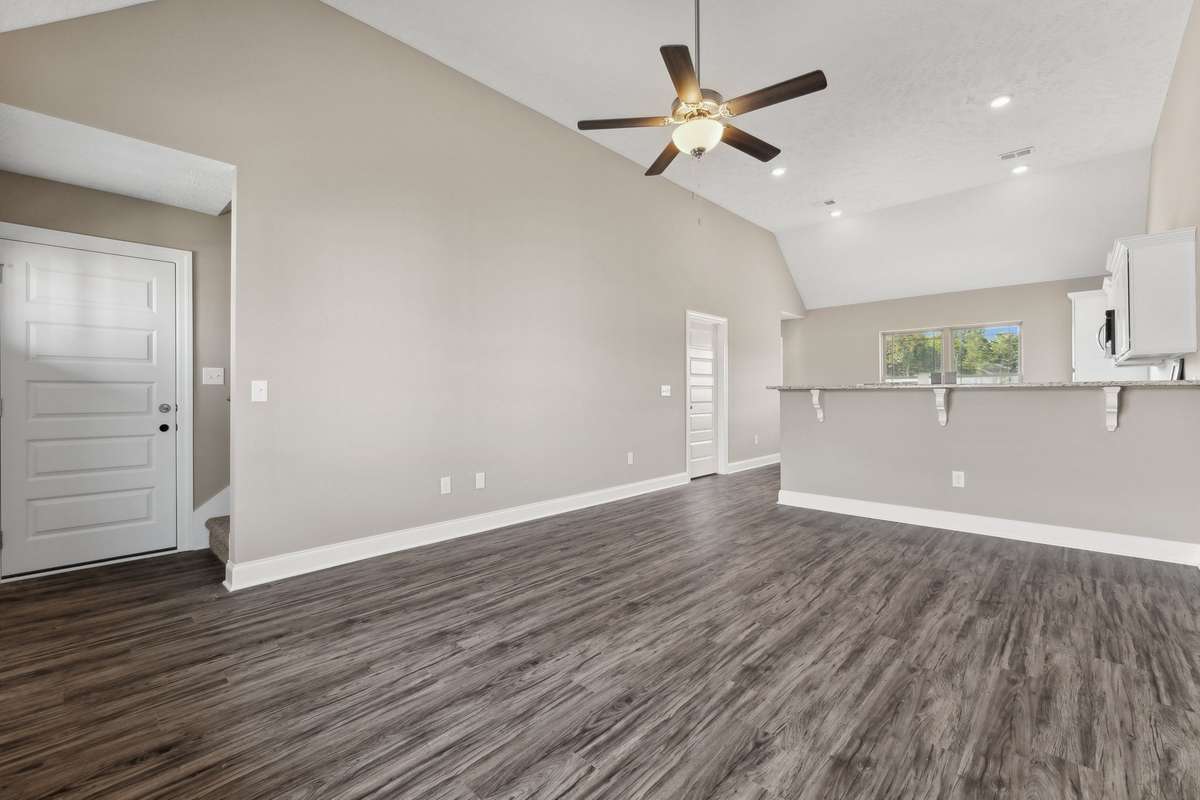 Living Room and Kitchen are Open House Plan with Vaulted Ceiling.