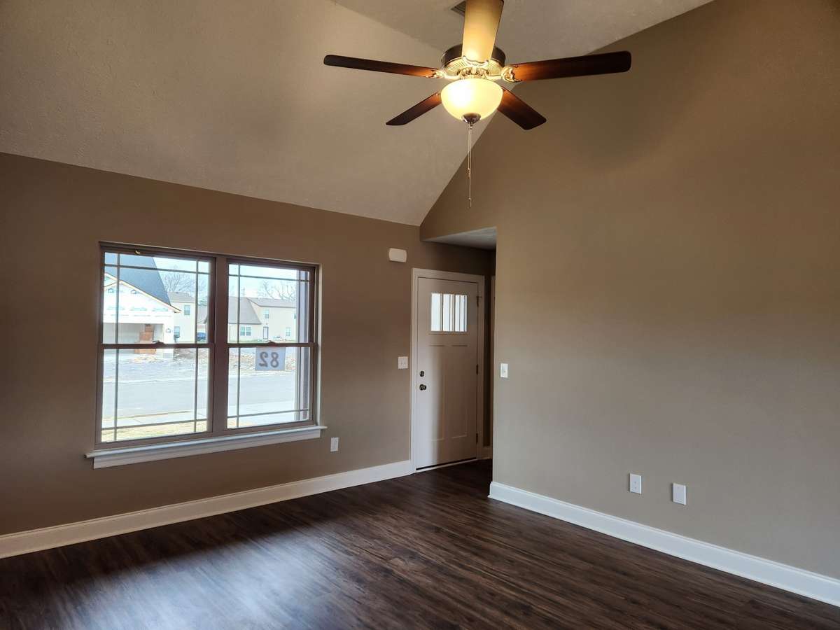 Living Room with Vaulted Ceiling and Ceiling Fan.