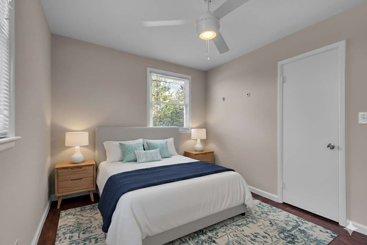 Again, virtual staging helps show the possibilities here in the second bedroom.Perfect guest or office space with neutral tones and natural light.