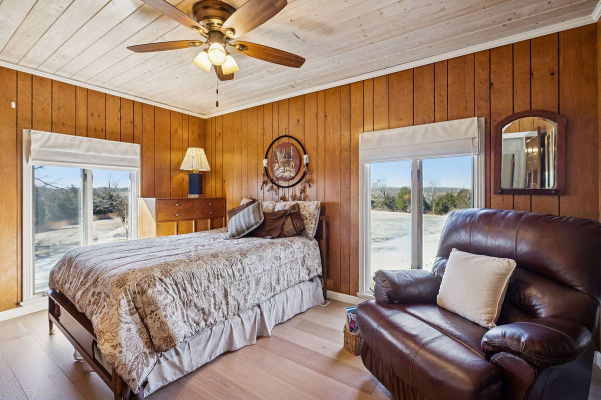 Bright and spacious guest bedroom with oversized windows to enjoy the amazing views! 1372 Short Mountain Rd, McMinnville, TN 37110